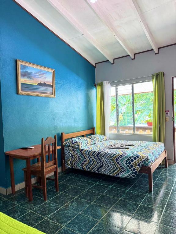 Postel nebo postele na pokoji v ubytování Hotel El Chaman