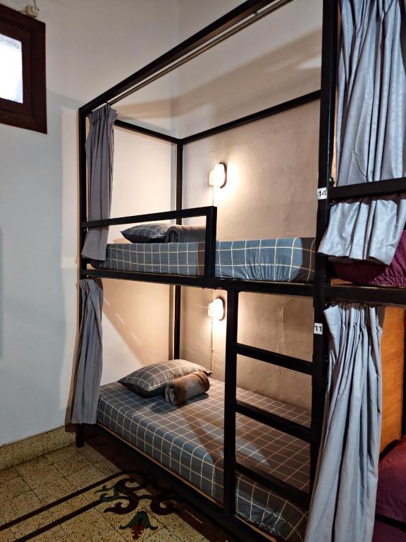 Postel nebo postele na pokoji v ubytování SEMERU HOSTEL MALANG