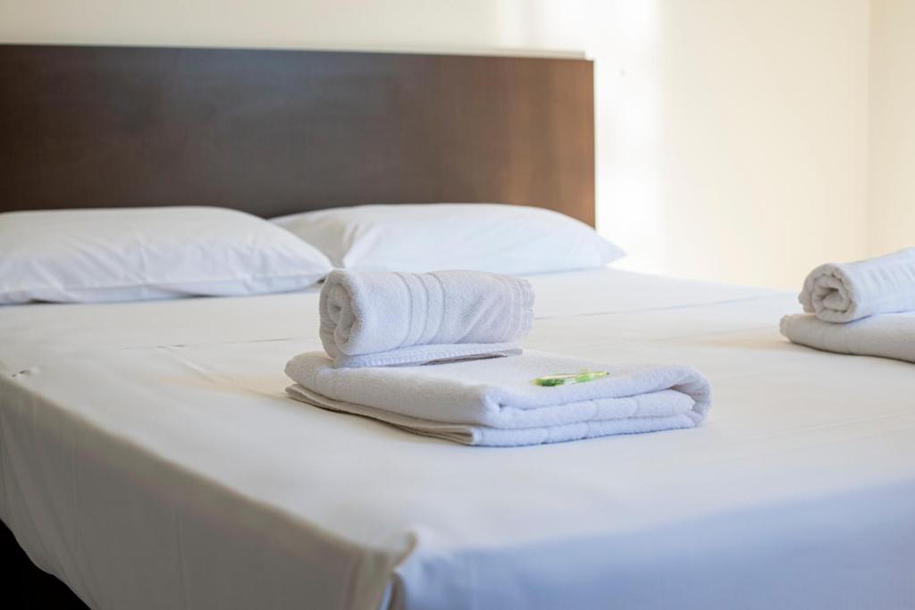 Postel nebo postele na pokoji v ubytování Smart Cataratas Hotel