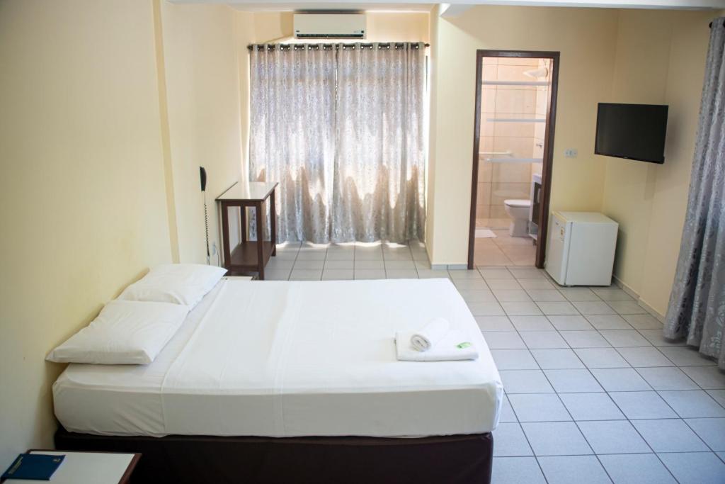 Postel nebo postele na pokoji v ubytování Smart Cataratas Hotel