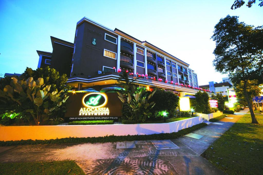 a building with a sign in front of it at Alocassia Serviced Apartments in Singapore