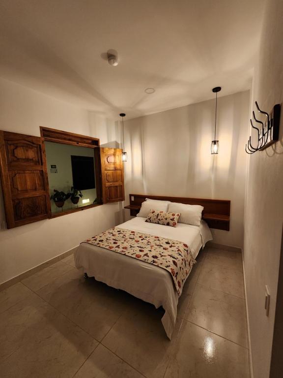 Postel nebo postele na pokoji v ubytování Casa Isabel Hotel