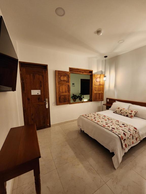 Postel nebo postele na pokoji v ubytování Casa Isabel Hotel