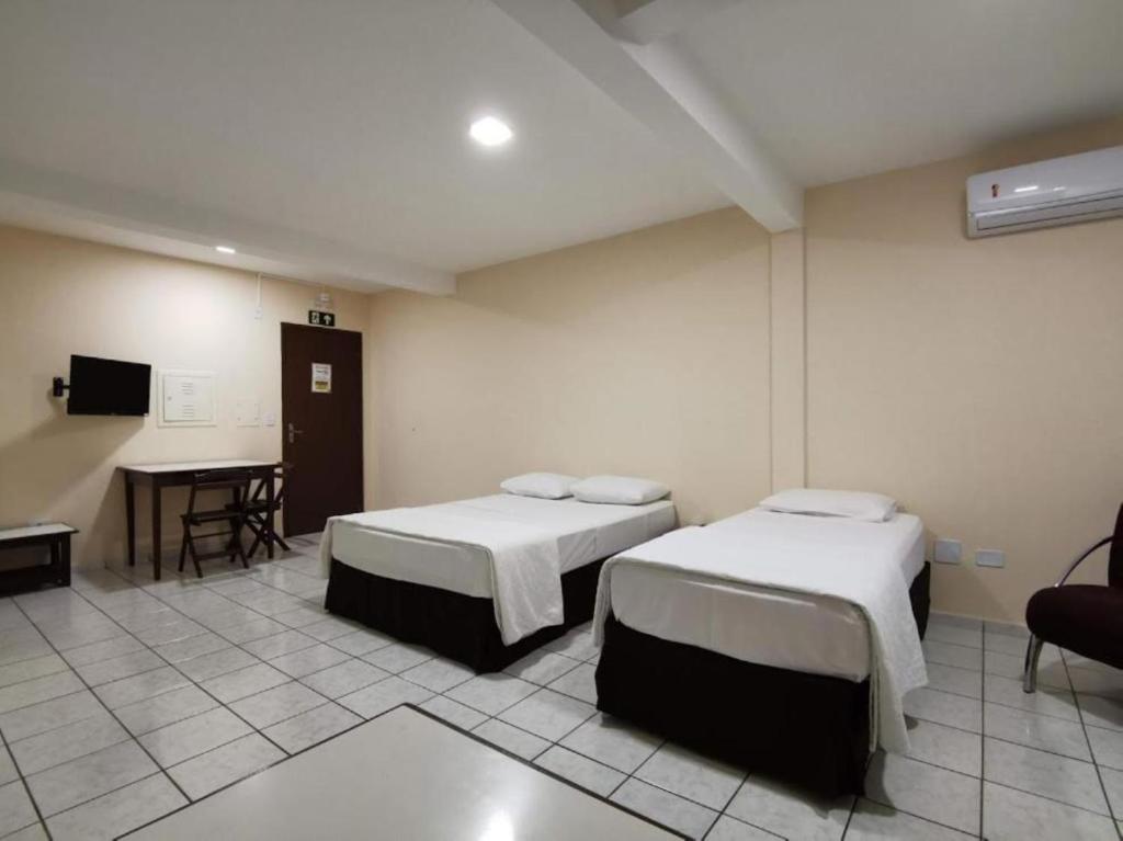 Postel nebo postele na pokoji v ubytování Smart Cataratas Hotel