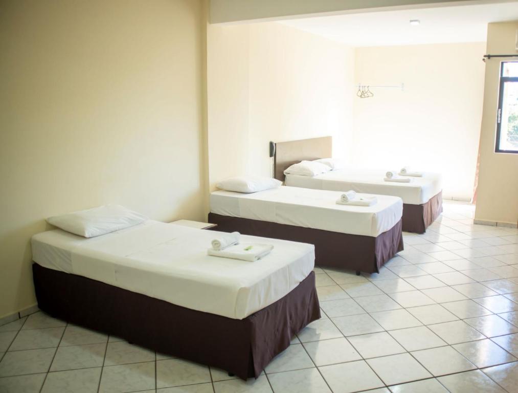 Postel nebo postele na pokoji v ubytování Smart Cataratas Hotel