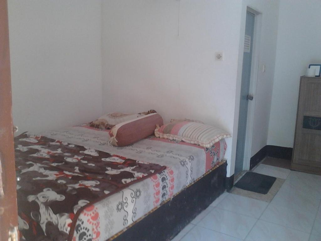 Postel nebo postele na pokoji v ubytování Diyah Homestay