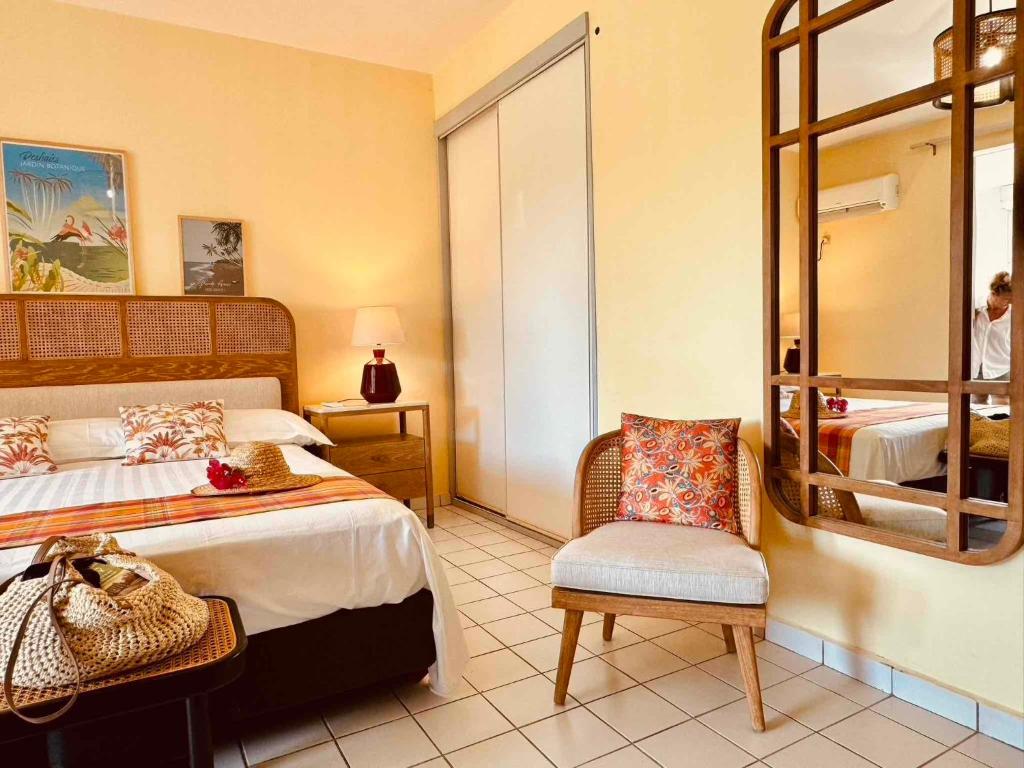 Postel nebo postele na pokoji v ubytování Résidence Le Vallon Guadeloupe Parc Piscine Appartements & Studios & Services hôteliers à la carte