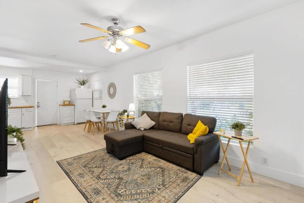 a living room with a couch and a ceiling fan at Dreamy 1-bedroom apt walking distance to Las Olas in Fort Lauderdale