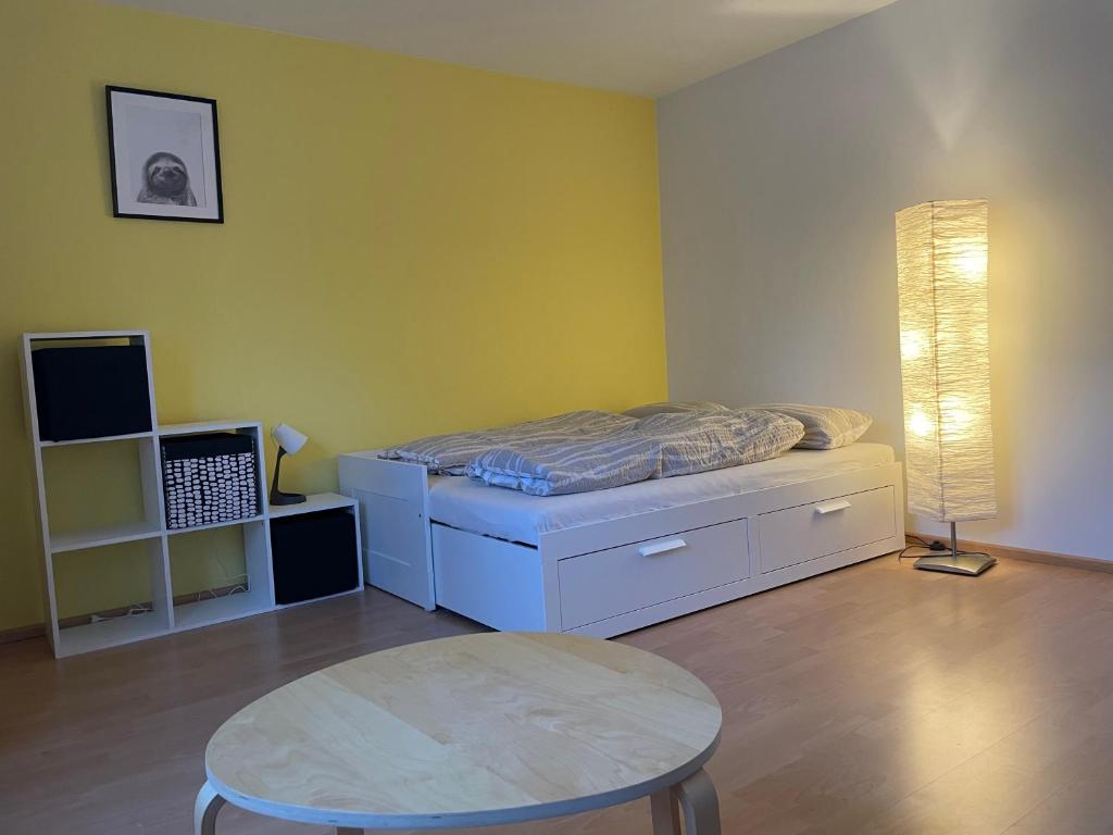 Postel nebo postele na pokoji v ubytování Modern eingerichtete private Ferienwohnung in Hennef - Nähe zu Bonn und Köln