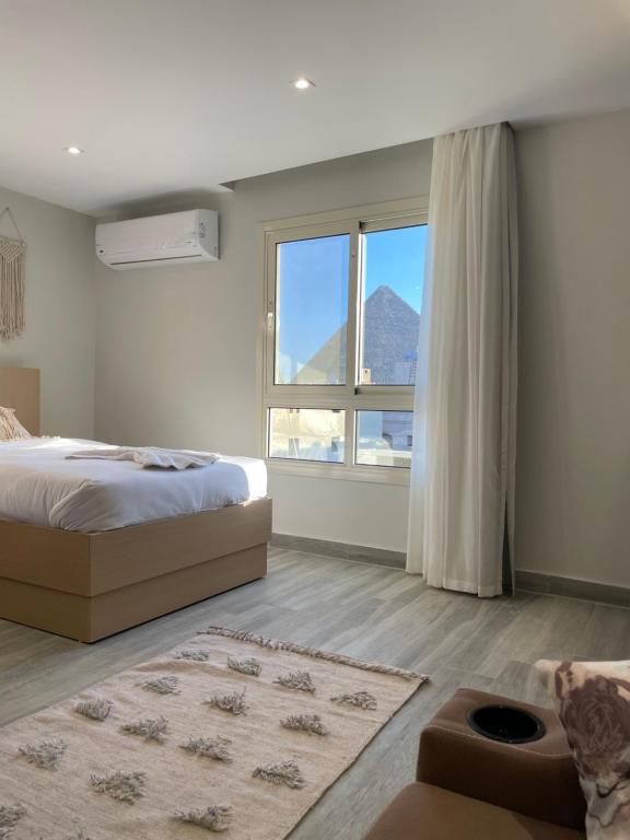 Postel nebo postele na pokoji v ubytování Diyar Pyramids Inn