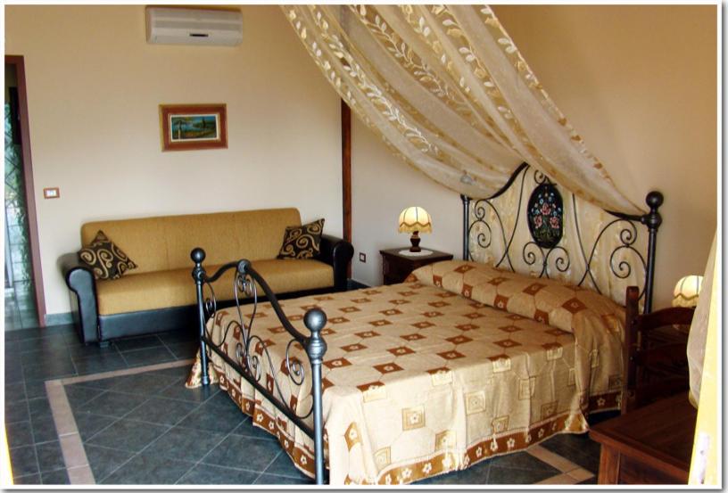 מיטה או מיטות בחדר ב-Agriturismo Ghiritina