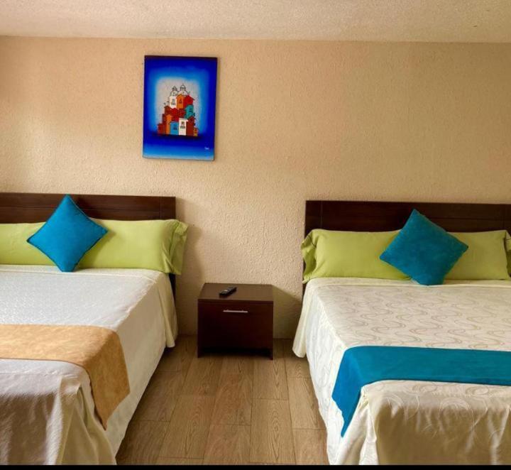 Postel nebo postele na pokoji v ubytování Hostal Monte Carmelo