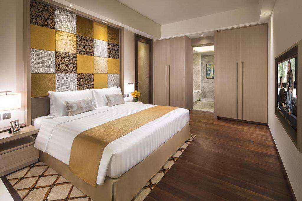 Postel nebo postele na pokoji v ubytování Ascott Macau