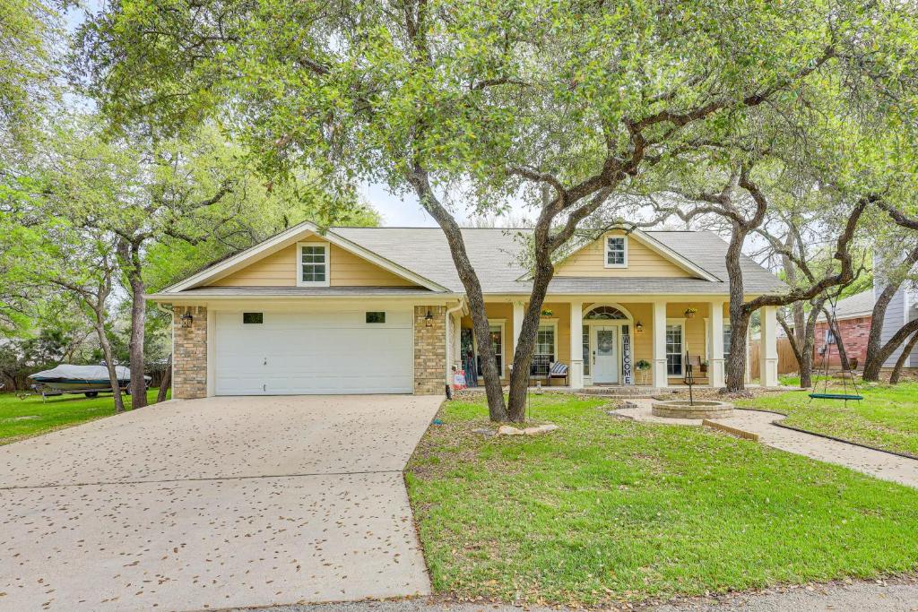 a house with a large driveway in front of it at 5 Mi to Belton Lake Peaceful Home with Hot Tub in Belton