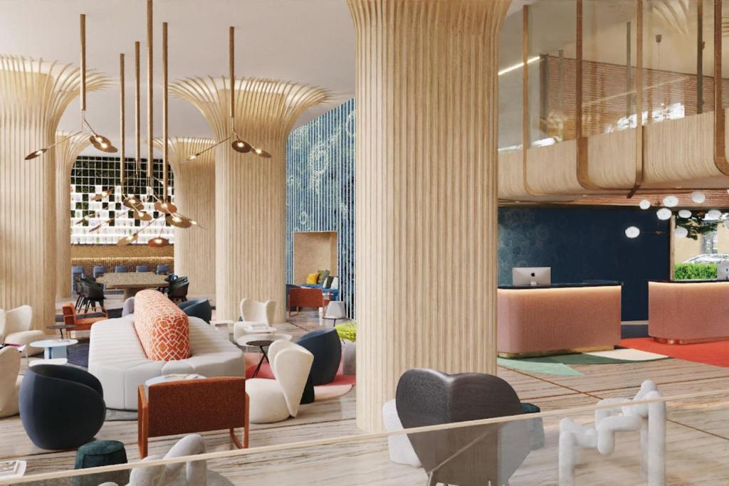 um lobby de um hotel com cadeiras e mesas em Labtwentytwo Barcelona, a Tribute Portfolio Hotel em Barcelona
