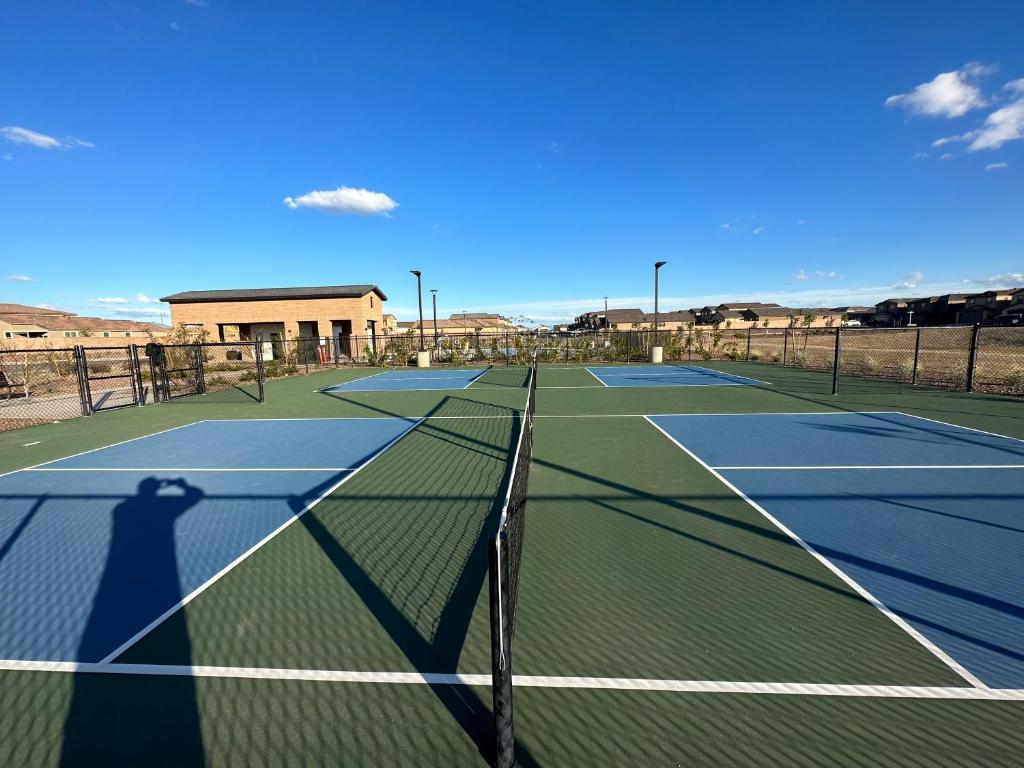 a tennis court with two tennis courts at Breeze Valley Homestay in Tucson
