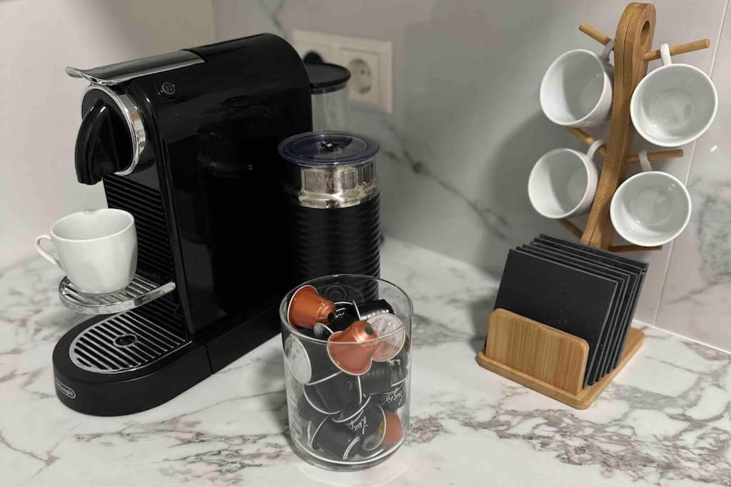 a coffee maker and a glass on a counter at 2Room Apartment in Best Place in Berlin