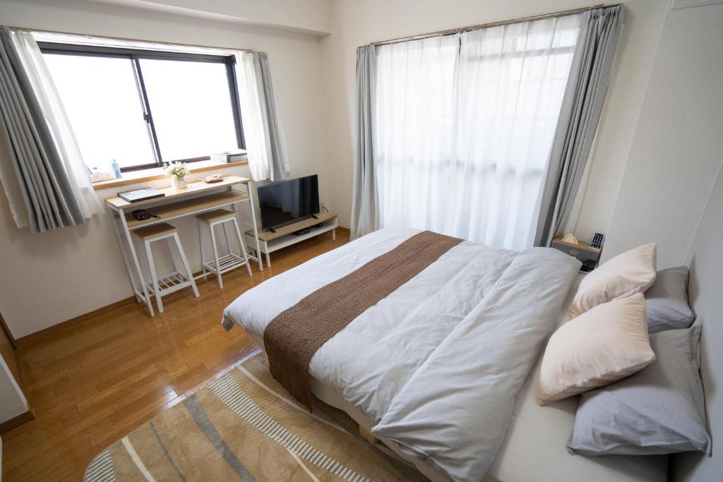 Postel nebo postele na pokoji v ubytování M233Near Nagoya Station&2minute walk from station