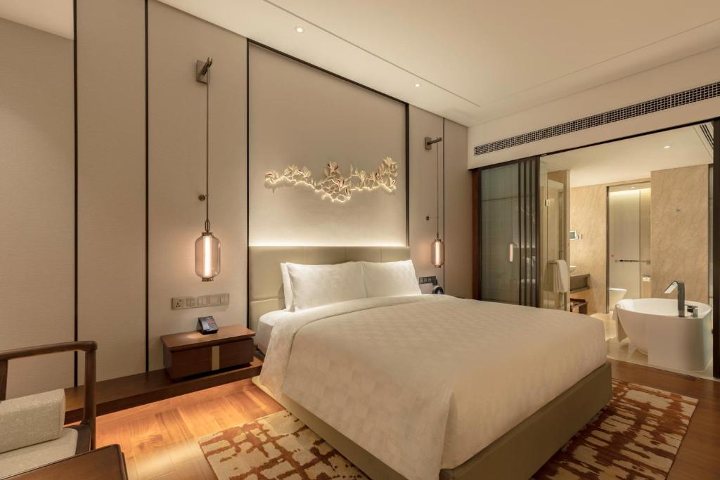 HUALUXE Beijing Xinan - Standard Zimmer Mit Kingsize-Bett