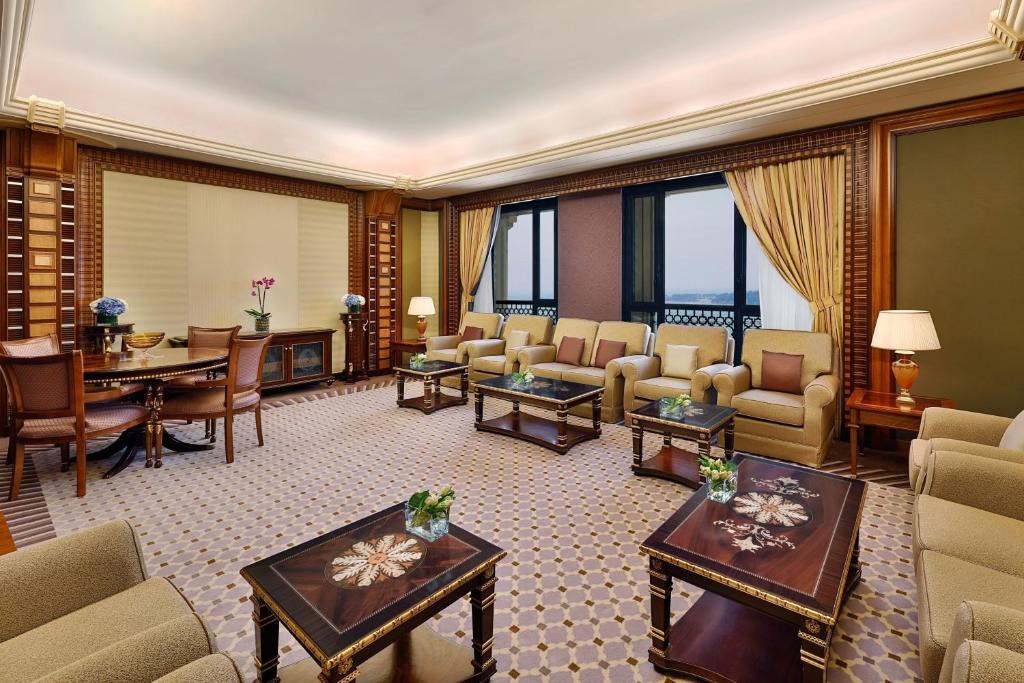 a living room with furniture and a dining room at The Ritz-Carlton Jeddah in Jeddah