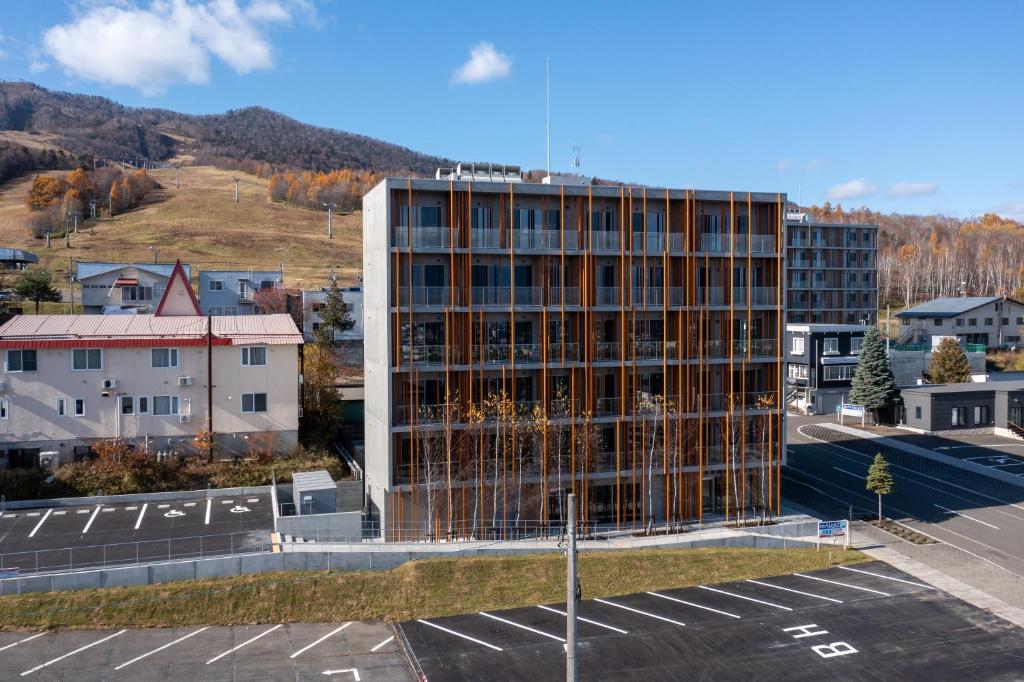 an office building under construction in a parking lot at Fenix West in Furano