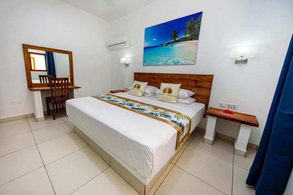 Katil atau katil-katil dalam bilik di Lazio Beach Residence