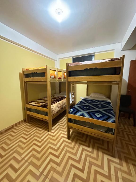 Giường trong phòng chung tại Wayki Guest House
