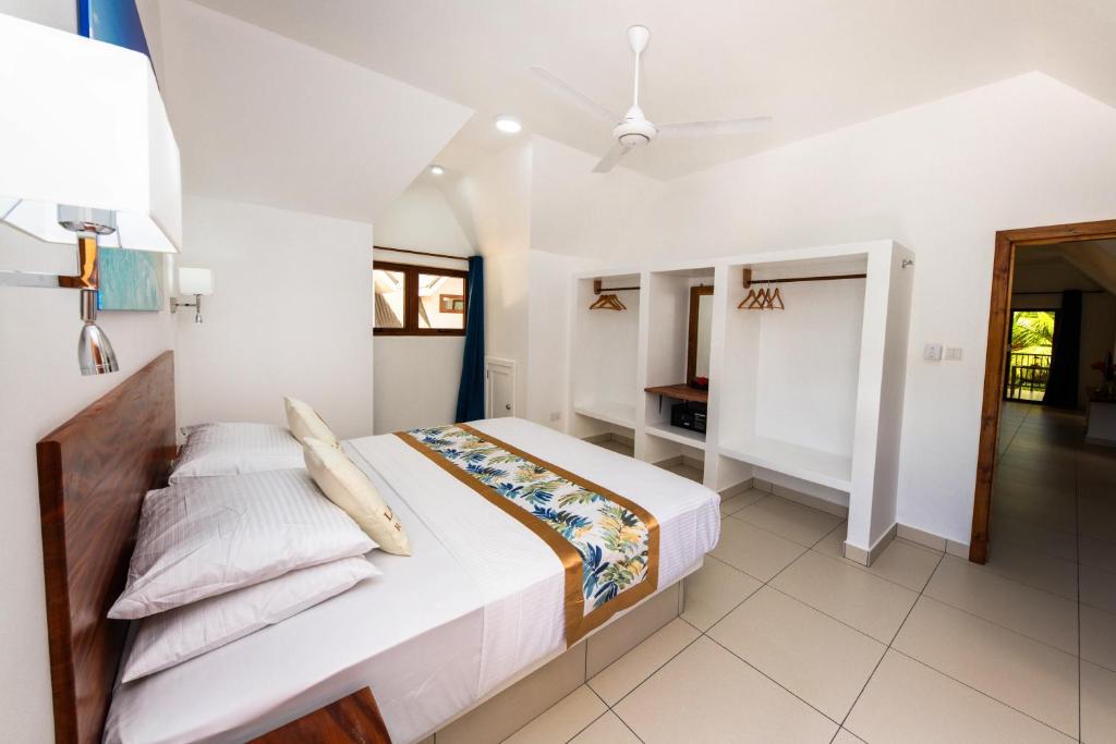 Katil atau katil-katil dalam bilik di Lazio Beach Residence