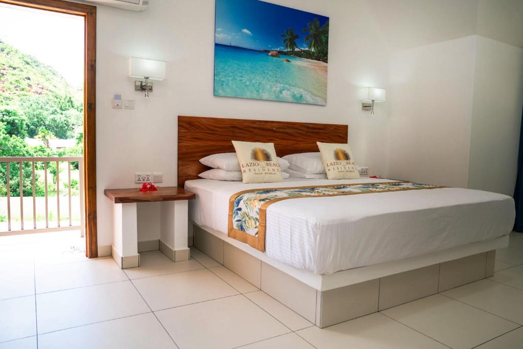 Katil atau katil-katil dalam bilik di Lazio Beach Residence