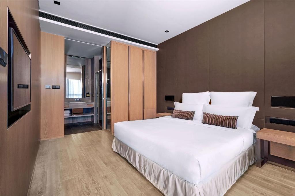 Nina Hotel Kowloon Eastにあるベッド