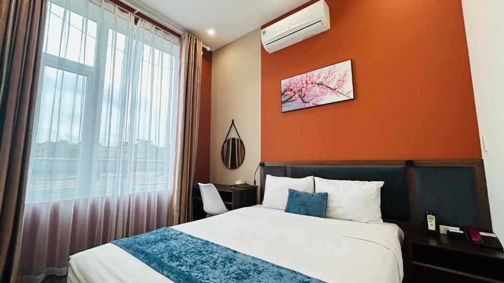 Postel nebo postele na pokoji v ubytování Mango Hotel - Ha Noi Railway station