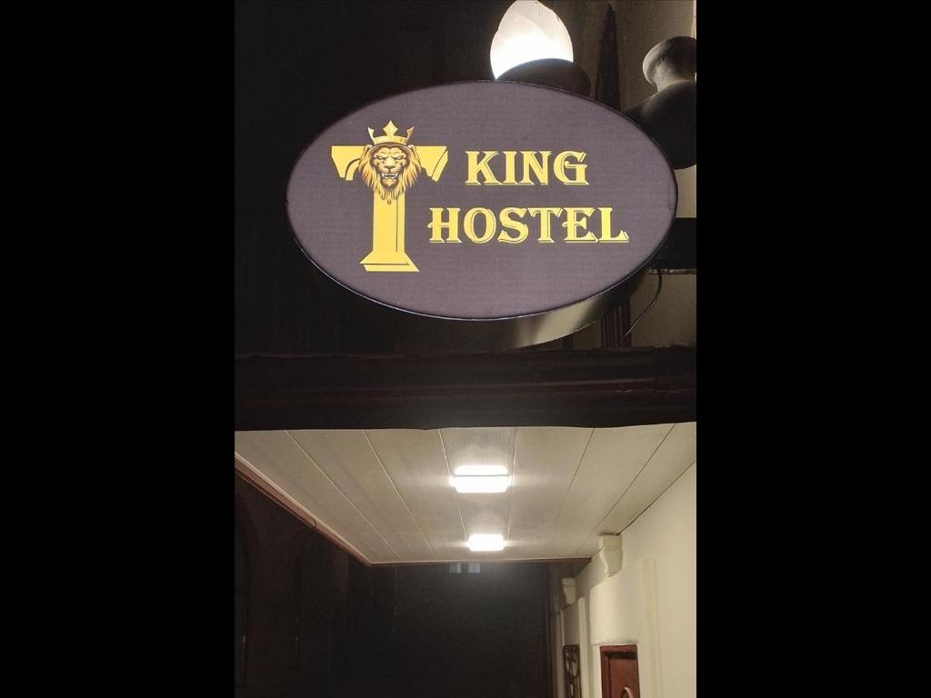 a sign for a king hospital on the ceiling of a hallway at KING Hostel in Center in Baku
