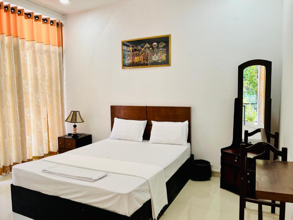 Postel nebo postele na pokoji v ubytování Eco Resort Kandy