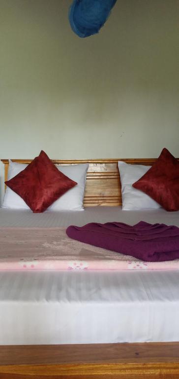 Postel nebo postele na pokoji v ubytování Himansa Homestay