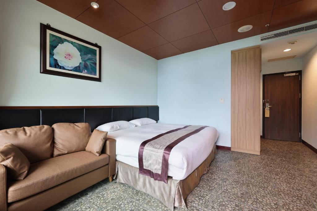 Postel nebo postele na pokoji v ubytování Shante Hotel Shitou
