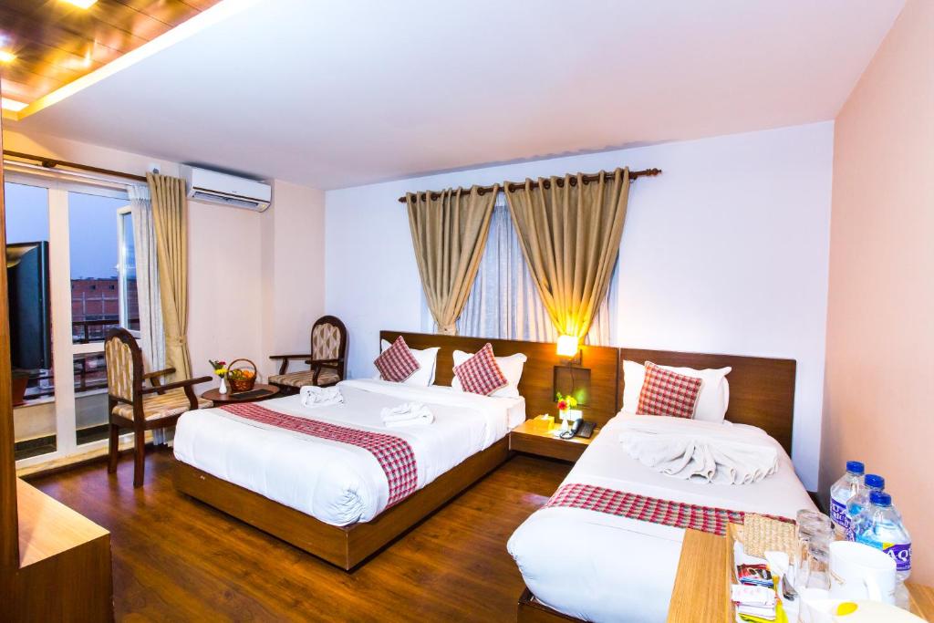 Postel nebo postele na pokoji v ubytování Kathmandu Suite Home