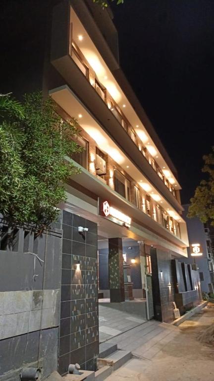 a building with lights on the side of it at night at M S RESIDENCY in Chennai
