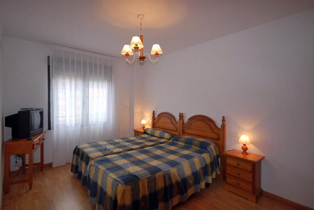Postel nebo postele na pokoji v ubytování Pension Paseo Real