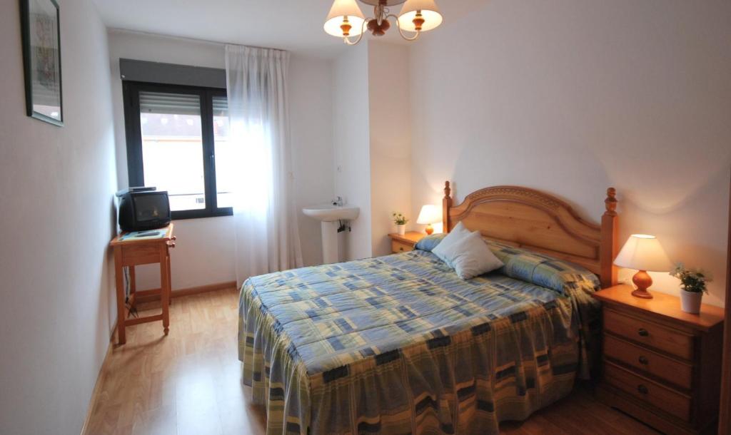 Postel nebo postele na pokoji v ubytování Pension Paseo Real