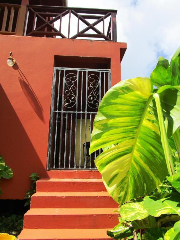 a house with a staircase leading to a window at The Sweet Retreat in Port Elizabeth
