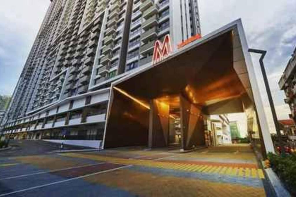 een groot hoog gebouw met een groot bord erop bij M Vertica 3BR KL Cheras with Netflix in Kuala Lumpur