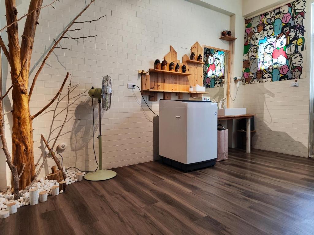 a kitchen with a refrigerator in a room at 棚棚屋室內帳篷民宿Inn in Kaohsiung