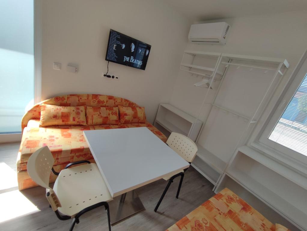 Postel nebo postele na pokoji v ubytování BÖJTÖS apartmány NESVADY