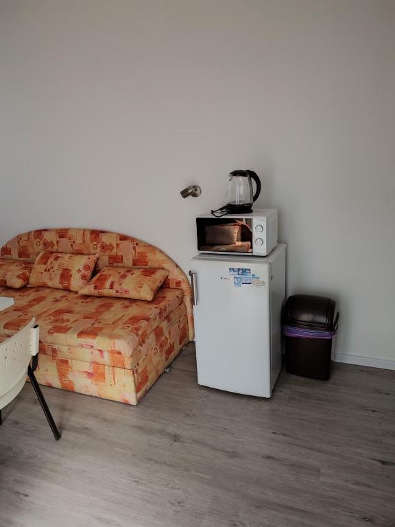 Postel nebo postele na pokoji v ubytování BÖJTÖS apartmány NESVADY