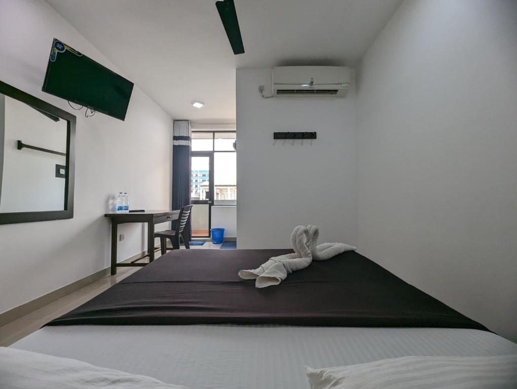 Postel nebo postele na pokoji v ubytování Big John Hotel