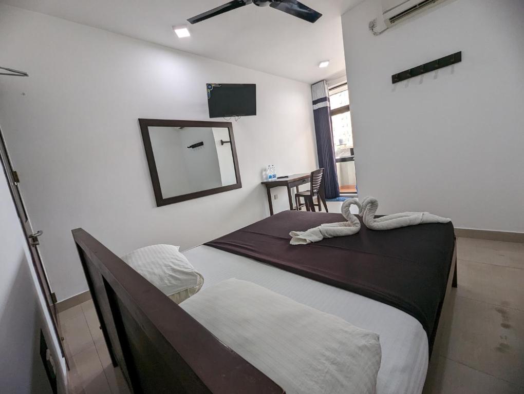 Postel nebo postele na pokoji v ubytování Big John Hotel
