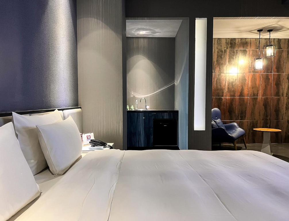 Postel nebo postele na pokoji v ubytování All-Ur Boutique Motel - Tai Tung Branch