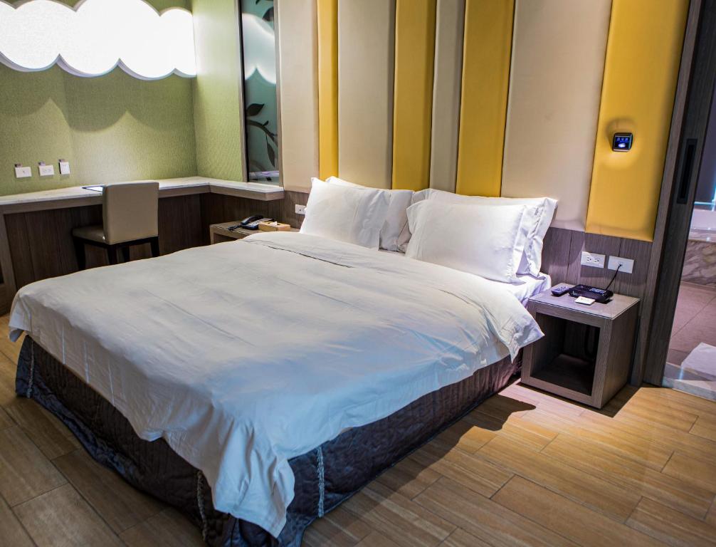 Postel nebo postele na pokoji v ubytování All-Ur Boutique Motel - Tai Tung Branch