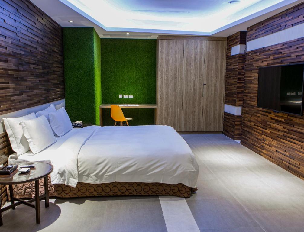 Postel nebo postele na pokoji v ubytování All-Ur Boutique Motel - Tai Tung Branch