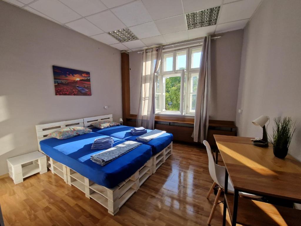 מיטה או מיטות בחדר ב-Lambo's Corner Varna